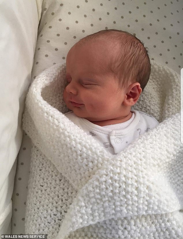 Evie Smith was born by c-section on January 16th this year, weighing 7lbs 7oz – her parents Mr and Mrs Smith must now formally adopt her because parental rights automatically go to the surrogate and her partner – Mrs Smith