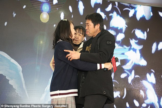 A teary Xiao Feng hugs her emotional parents after meeting them on stage in Shenyang today