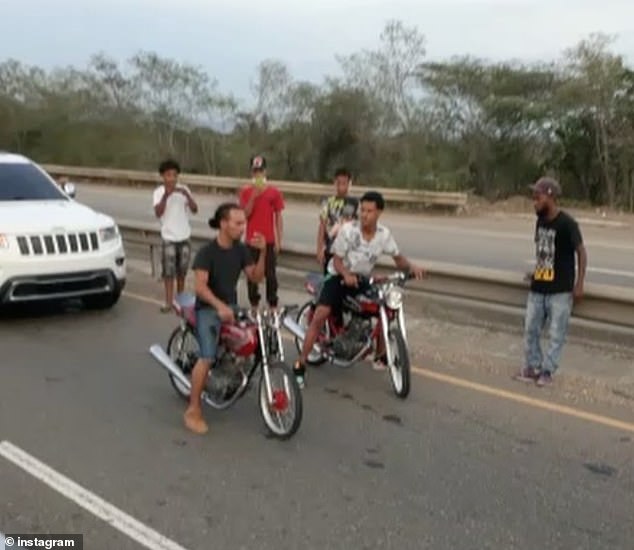 Pictured above are two participants of an illegal motorcycle race in the Dominican Republic that left bystander Juan Infante dead after he was struck by a car who was speeding behind the bikers while a passenger filmed the tragic moment