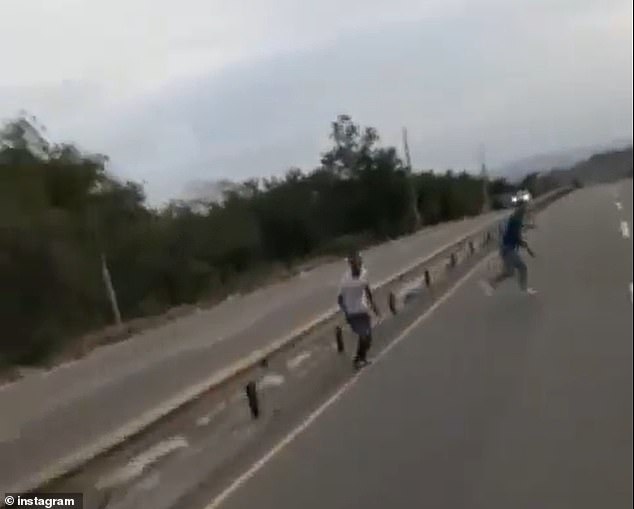 Juan Infante (top right) tried to run across the highway before he was fatally struck by a car during an illegal motorcycle race in the Dominican Republic