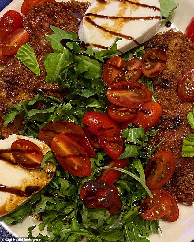 Mangia! The catwalker also went for some Italiano recently and shared a photo of a play on a caprese salad with what looked like crispy chicken underneath