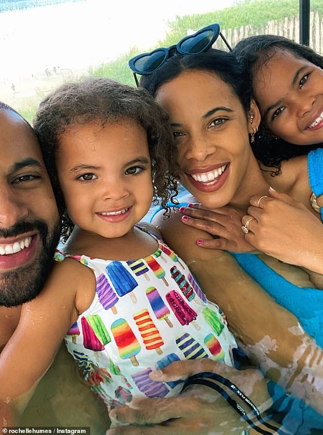 Family matters: Rochelle Humes was beaming from ear to ear as she posed for a photo on Saturday with her husband, Marvin Humes, and their children Alaia-Mai and Valentina